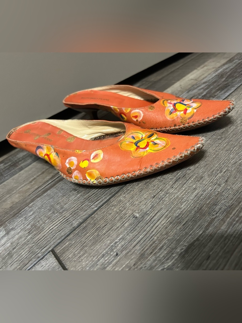 Vittorio Piani orange leather featuring a hand-painted floral kitten heel